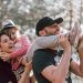 Happy family having fun in a forest, capturing joyful bonding moments.
